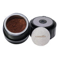 Ground Coffee Chamber featuring finely ground coffee inside a sleek container with a secure lid.